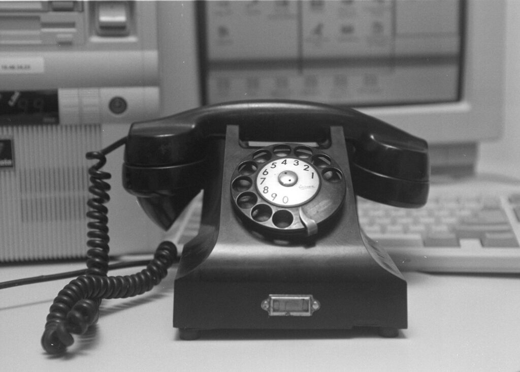 black and white photo of a rotary phone